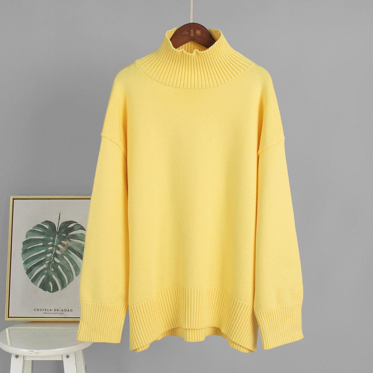 Suéter de cuello alto transfronterizo para mujeres 2025, Europa y los Estados Unidos de otoño y invierno explosivo color sólido jersey de punto de cuello alto suéter suelto para mujeres