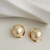 Design metal earrings from pearl, trend of season