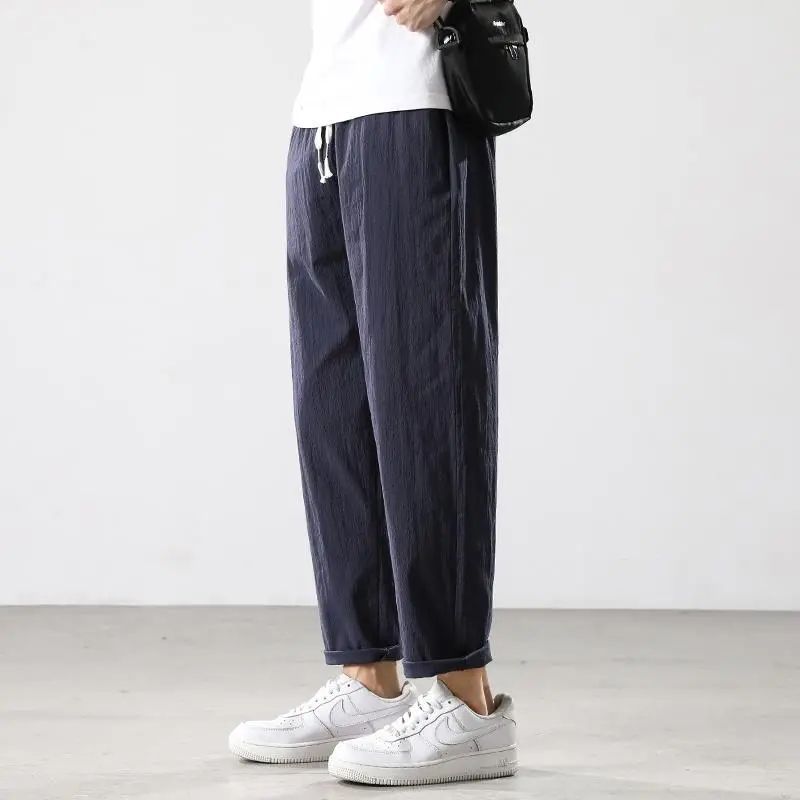 Pantalones de hombre de estilo chino pantalones de lino sueltos casuales primavera y verano pantalones harem de pierna ancha de lino de algodón recto fino linterna