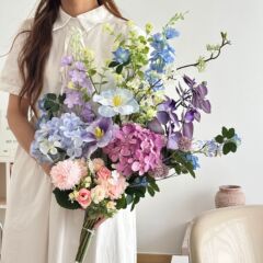 アジサイのバラのシミュレーション花の造花の花束の客間の装飾は卒業の季節を飾って写真を撮ります。
