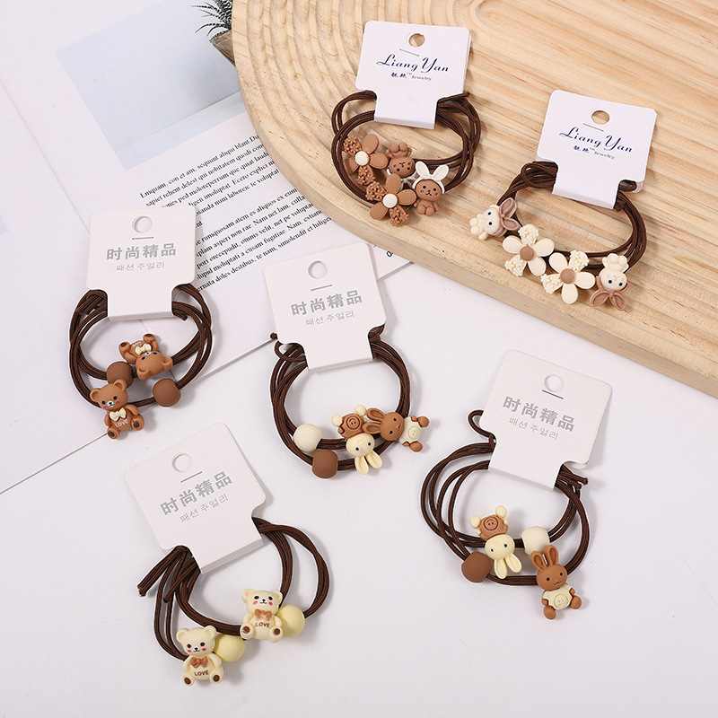 009 Ventas Directas Tarjeta de orden camuflaje A cuadros intestino grueso banda de pelo cuerda de pelo banda de goma tienda física dos yuanes tienda accesorios para el cabello accesorios para la cabeza