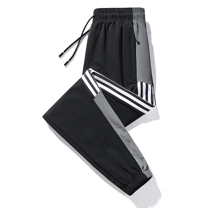 Nuevos pantalones deportivos, pantalones casuales delgados de otoño para hombres, pantalones de guardia de tres barras sueltos de tendencia, fábrica al por mayor