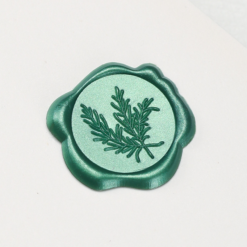 今図の植物の小さいワックスの標識のローズマリーの多色の火の漆の印鑑のシールの封筒の封口は火の漆を貼って決められます。|undefined
