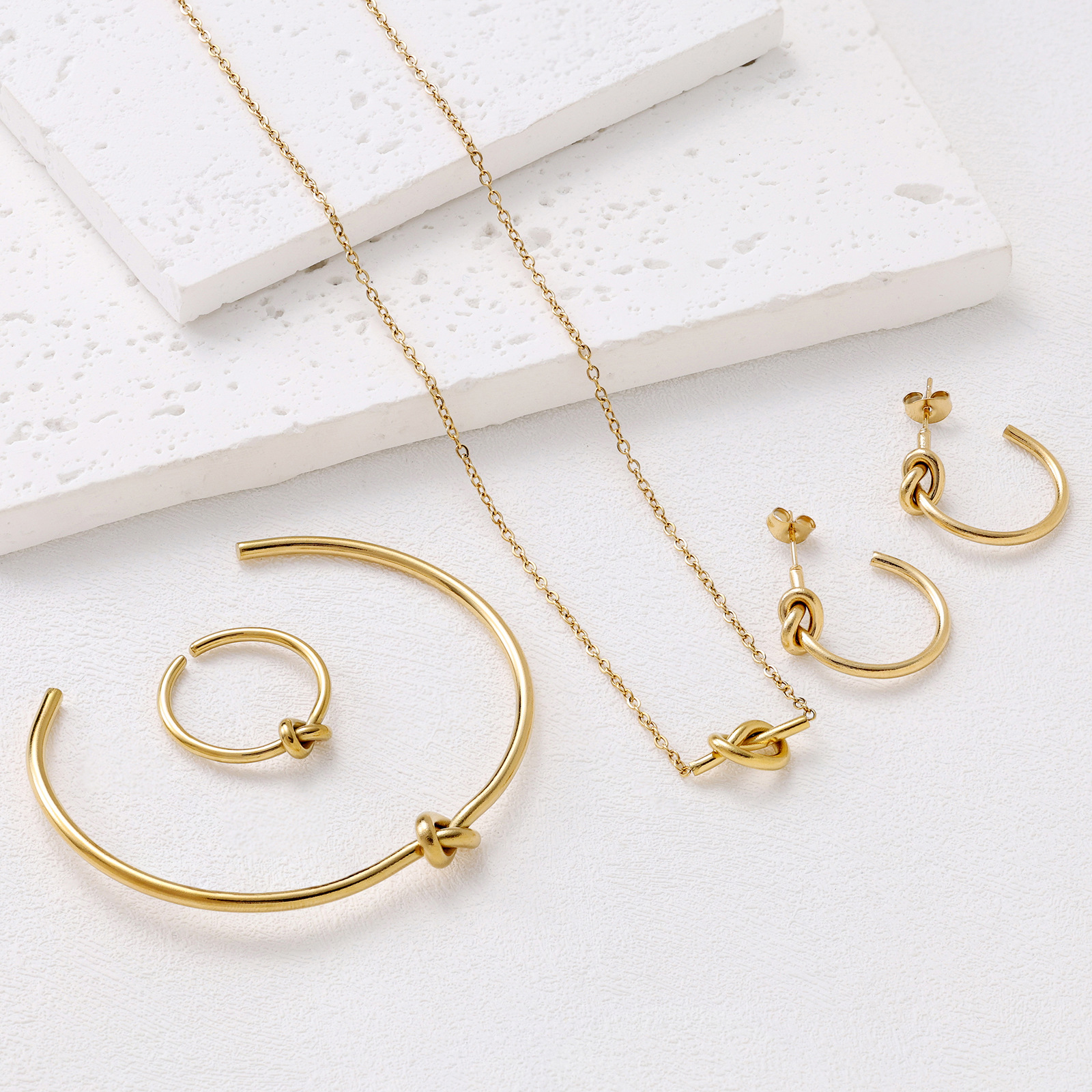 New cross-border titanium steel love knot pendant necklace bracelet earrings ring suit ladies niche all-match jewelry