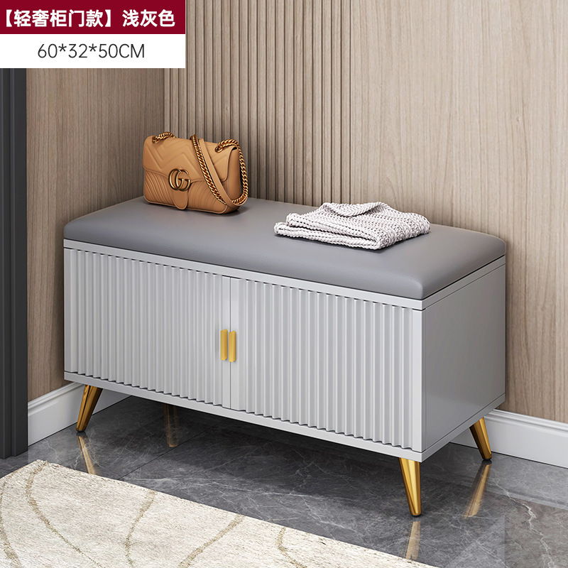 Fábrica directa de cambio de zapatos taburete zapatos gabinete integrado puerta de entrada se puede sentar bolsa de lujo suave asiento taburete puerta de almacenamiento doméstico