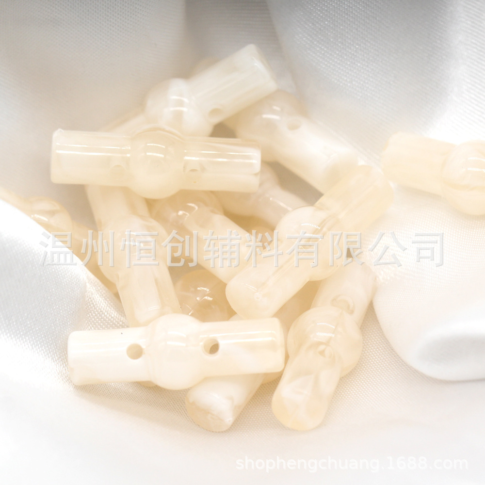 25x9mm brillante Hengchuang botón de resina cilíndrica de dos agujeros botón de estilo nacional suéter de punto botón de color de bricolaje al por mayor