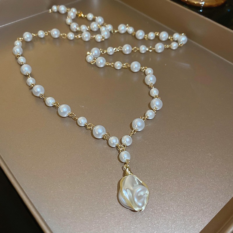 Collar con cuentas de perlas de gota de agua con diamantes transfronterizos otoño e invierno cadena de suéter de lujo ligero francés moda todo fósforo joyería de alta gama