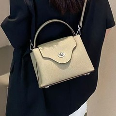 トップの牛革の斜め掛けの女性バッグは、シングル肩で手に入れることができるファッション街の撮影モデルの本革のカバーをめくる女性バッグの牛革バッグです。