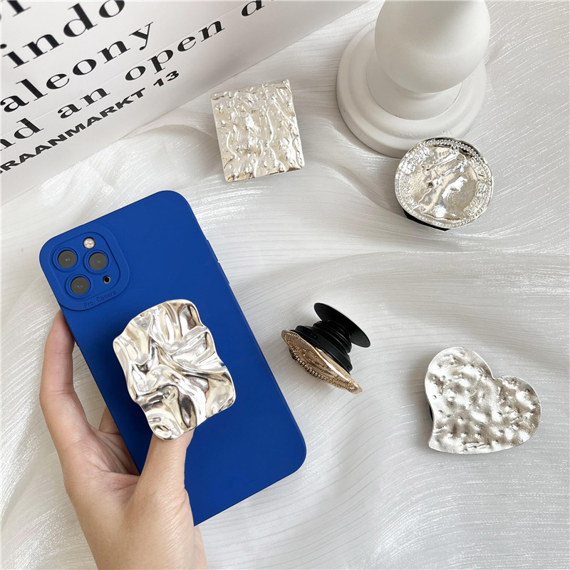 Retro estilo frío metal airbag soporte perezoso soporte de escritorio pegatina retráctil plegable cojín de aire soporte del teléfono móvil