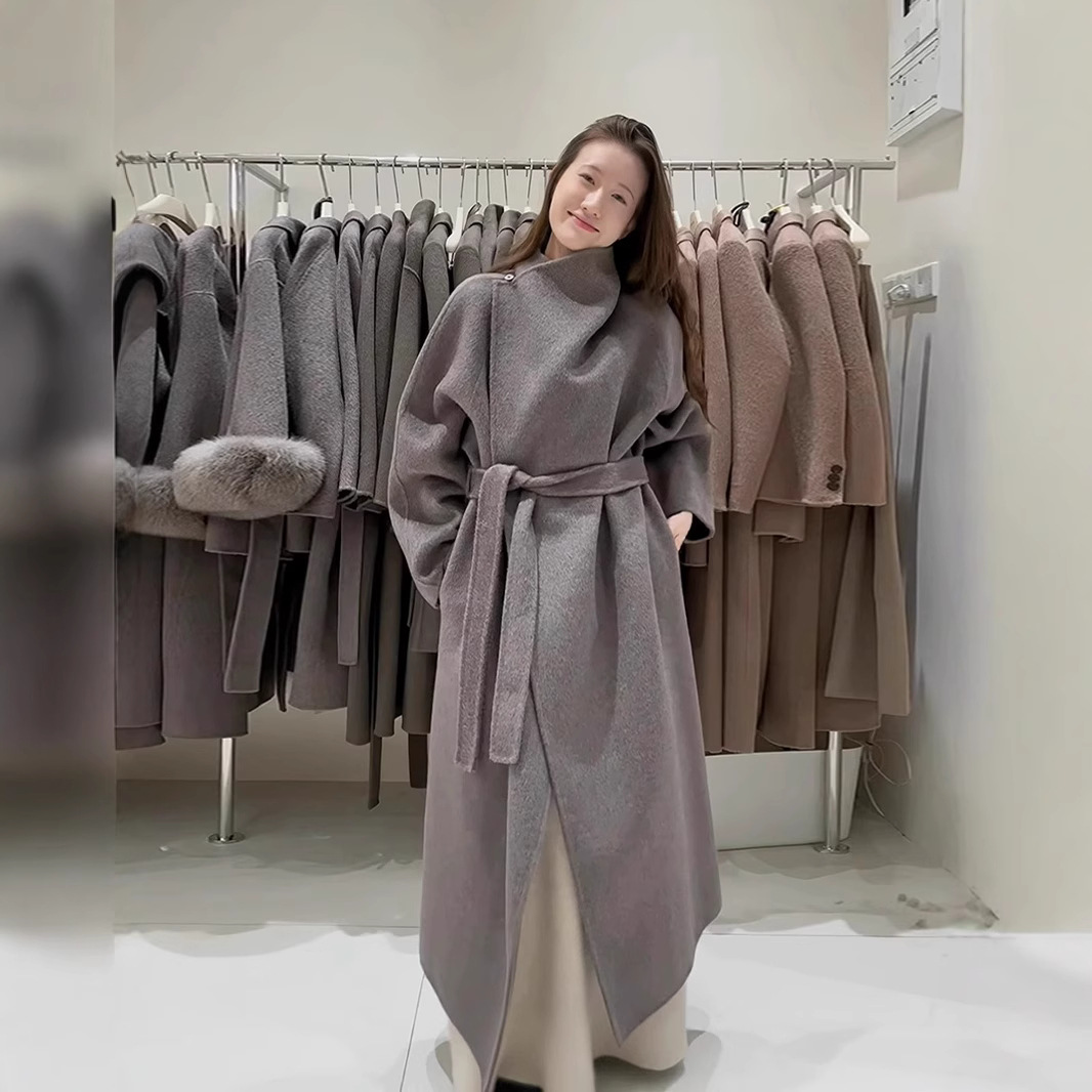 하이 엔드 단색 스탠드 칼라 긴 모직 코트 여성의 겨울 새로운 스트랩 허리 우아한 모직 코트