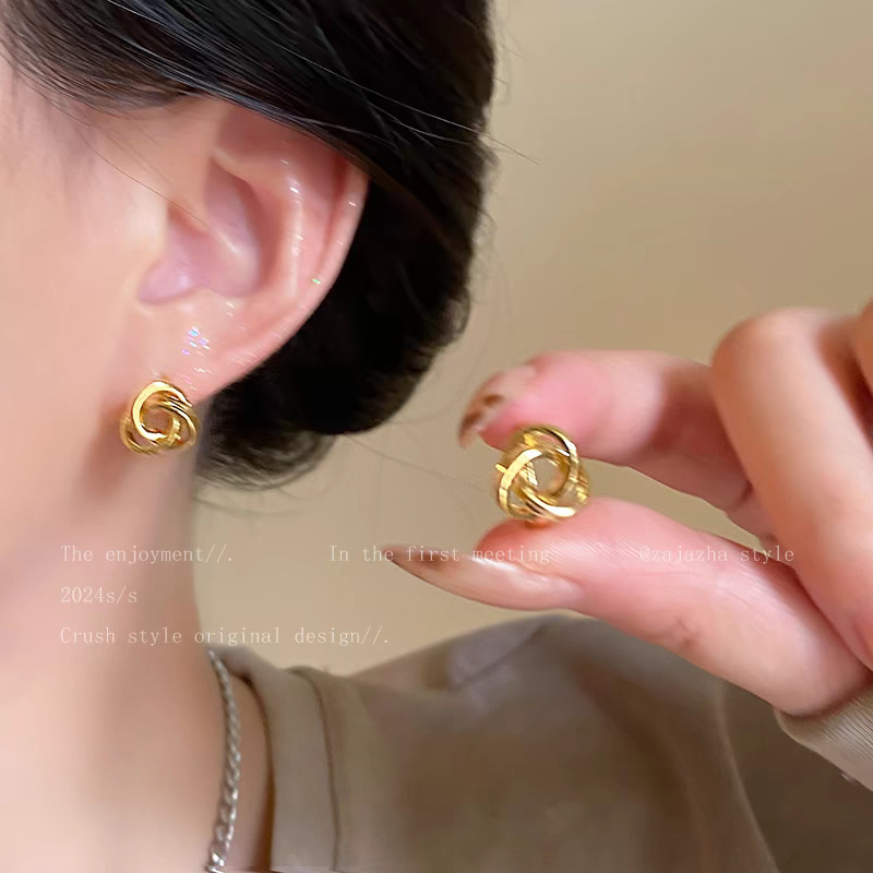53 # Gold two-strand twist knotted earrings