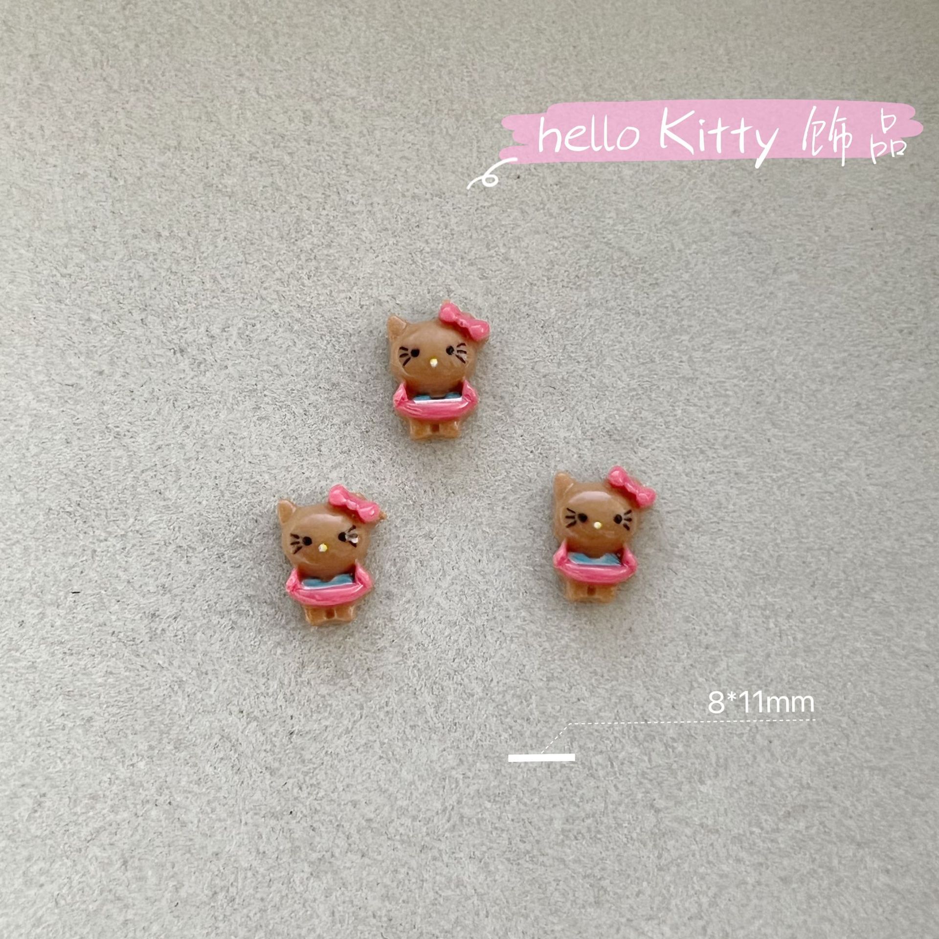 新商品のキティキャットの三麗鴎のネイルアクセサリーのネットの赤い爆発の樹脂のかわいいkt猫は甲を着て飾ります。