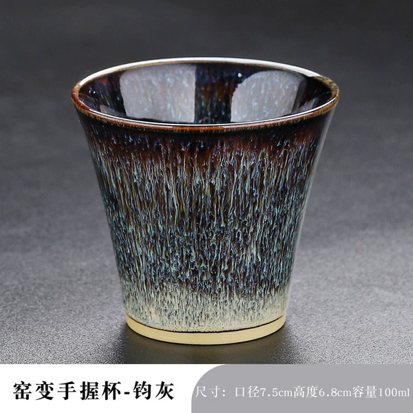 Jun ash hand holding a cup