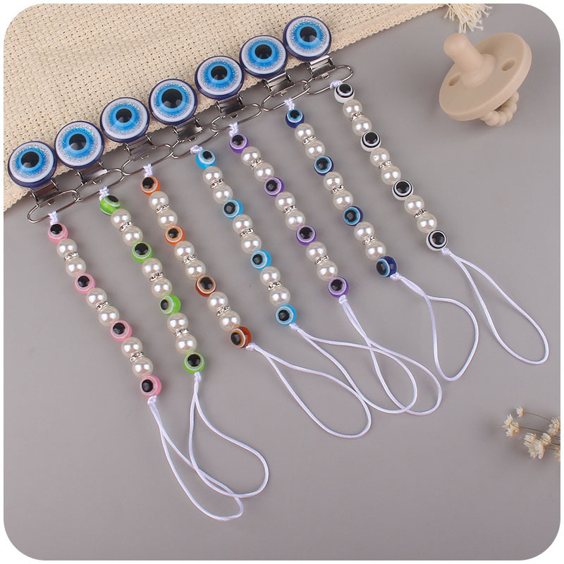 Suministros para bebés chupete de acrílico cadena anti-gota ojos azules bebé chupete clip chupete cadena Amazon nuevo