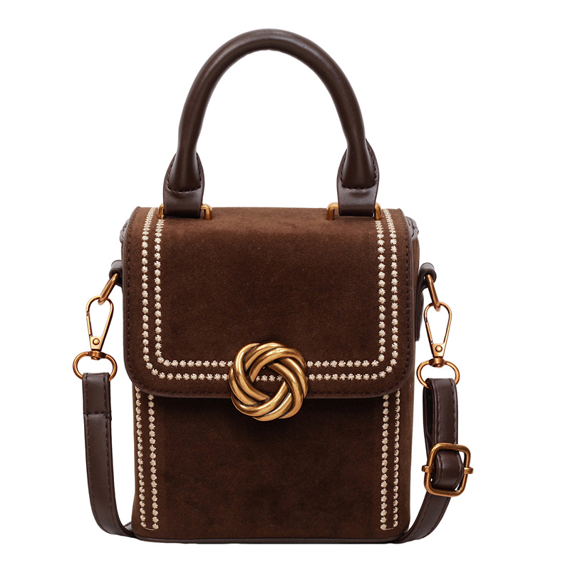 Retro alta sensación vertical bolso de mano pequeña mujer otoño / invierno 2025 nuevo estilo de moda bolso de hombro simple bolso de mochila