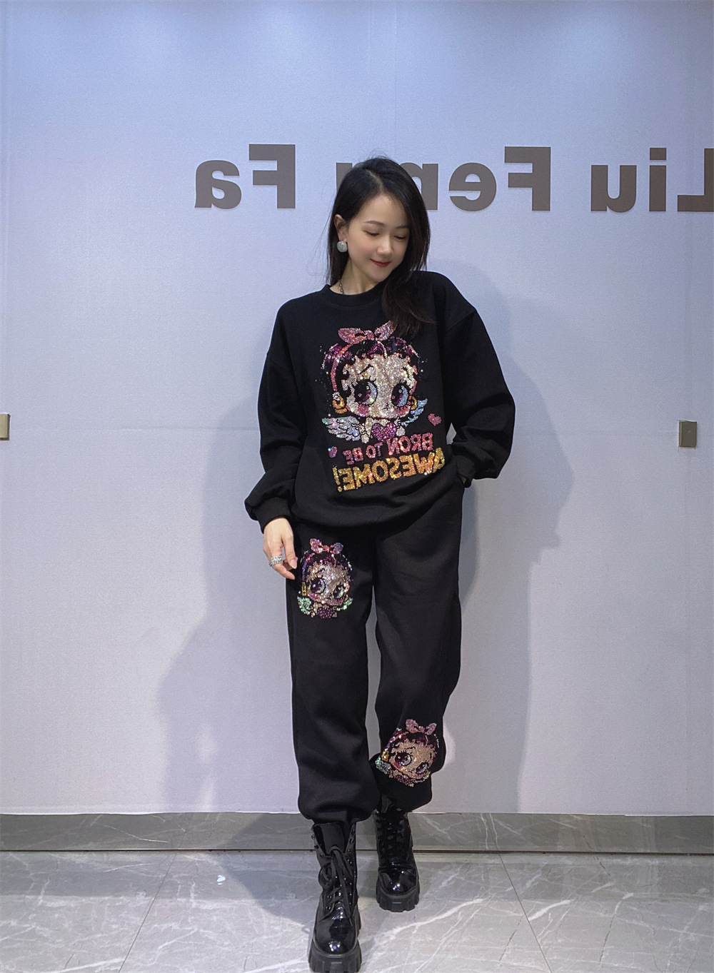 Europa y América ropa de mujer estilo coreano de diamante caliente cuello redondo manga larga suéter de vestir para mujeres de otoño y invierno pantalones sueltos de dos piezas de ropa deportiva