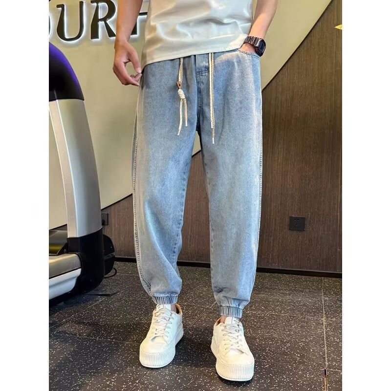 Jean de jogging à taille élastique pour homme, coupe ample et tendance, style harem, idéal pour le printemps et l'automne. Pantalon fuselé polyvalent et décontracté._voghion.com