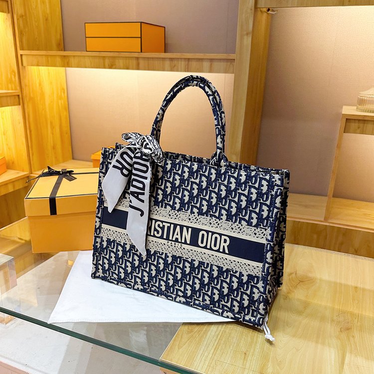 Bolsa grande para mujeres 2025 nueva moda red lienzo rojo de moda bolsa de hombro brazo universal de gran capacidad bolso de mano