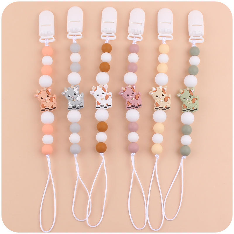 Nuevo bebé suministros chupete cadena creativa de dibujos animados Cordero silicona bebé mordedura cadena anti-gota molar