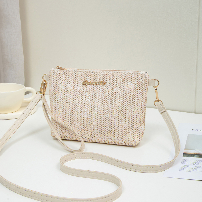 Bolso de verano para mujeres 2025, nuevo estilo de tela tejida bolso de paja de moda bolso de hombro con cámara bolso de mochila un cabello