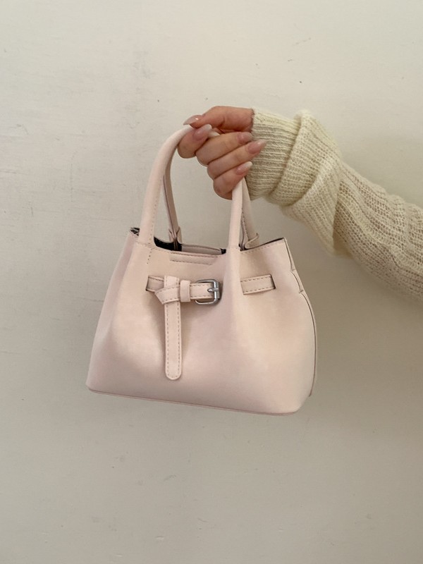 Diseño de nicho simple bolso de cubo portátil para mujeres 2026 nuevo estilo coreano de textura de alta calidad casual versátil bolso de tramo inclinado