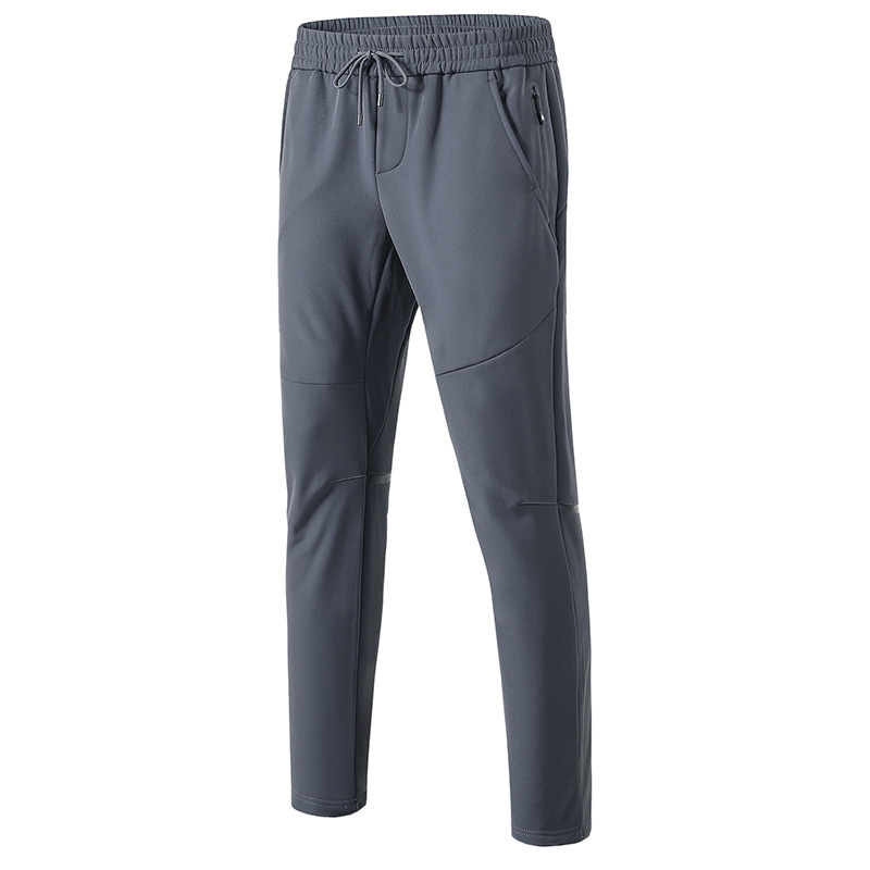 Pantalones de combate al aire libre hombres y mujeres pareja de invierno a prueba de viento impermeable forrado de lana deportes soft shell transpirable montañismo pantalones al por mayor