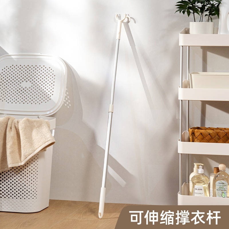 支え棒家庭用服とフォークの竿は服を干します。|undefined