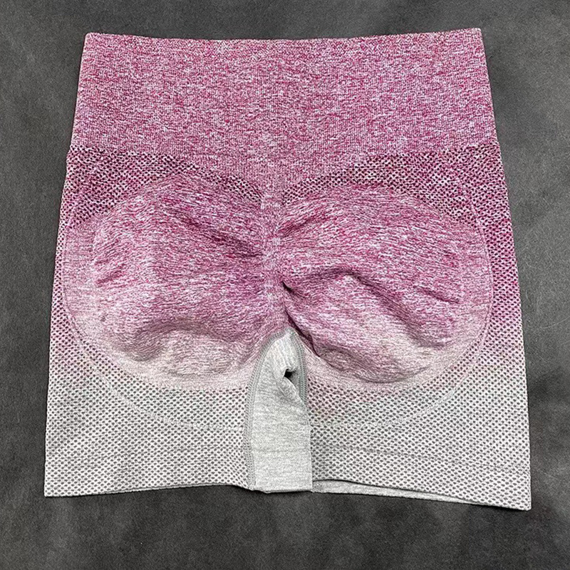 Pantalones cortos de yoga sin costuras teñidos con gradiente transfronterizo europeo y americano transpirables de las mujeres de secado rápido Melocotón Cadera apretada cintura alta estiramiento tres puntos