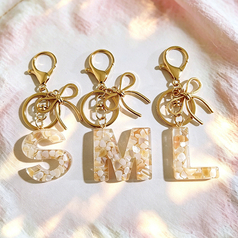 New resin initial keychain pendant with textured metal bow bag charm, women's accessory gift New resin initial keychain pendant with textured metal bow bag charm, women's accessory gift