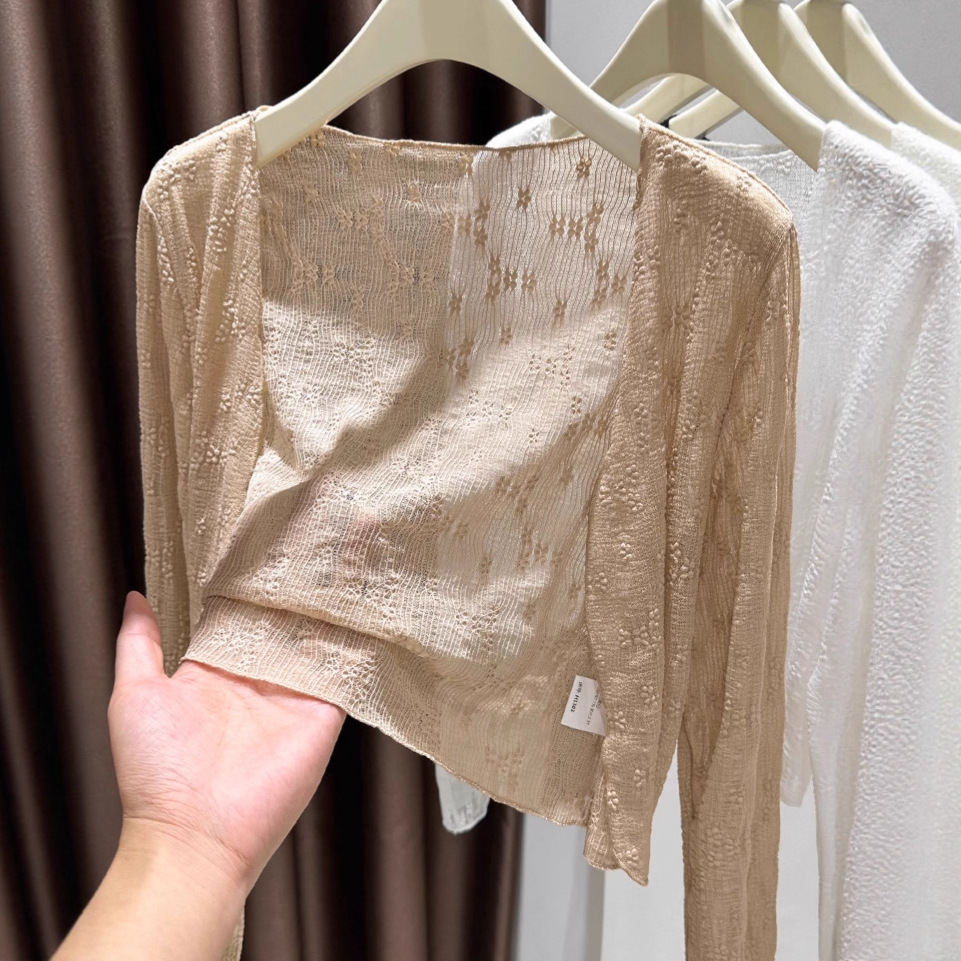 Women's thin sun protection cardigan/shoulder top paired with a slip dress