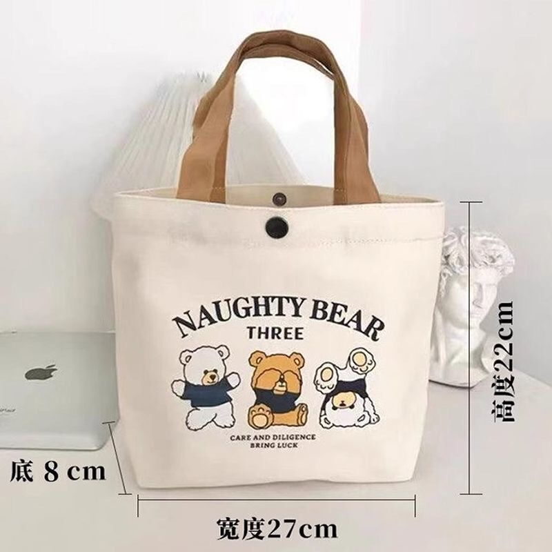 新商品の熊のキャンバスバッグの女子学生は携帯して出勤します。|undefined