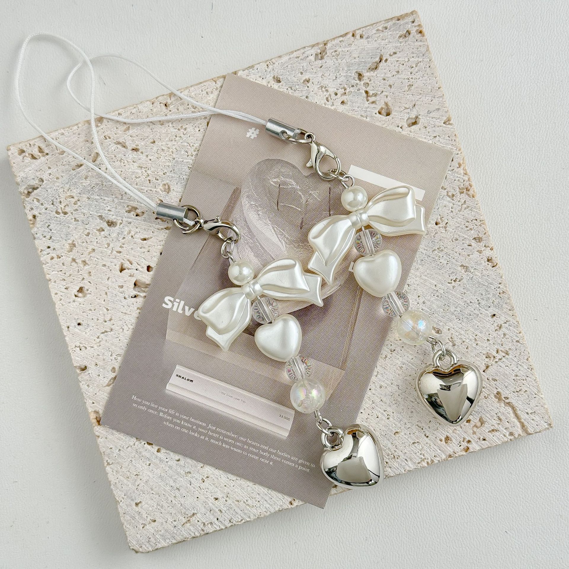 Nicho de arco simple coreano dulce perla plata amor cadenas de teléfono móvil Goku bolsa colgar llaveros