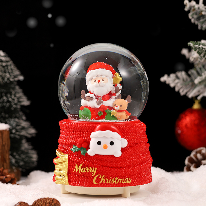 Una variedad de regalos de decoración de Navidad Navidad iluminante bola de cristal caja de música ventana diseño de velas lámparas de viento árbol de Navidad