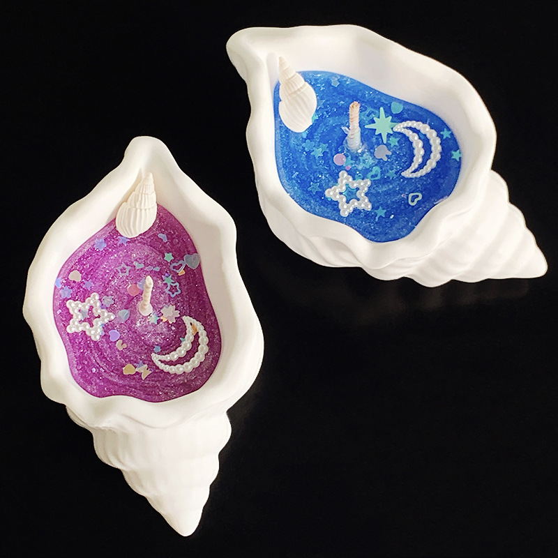 Doftljus formad som snäcka i presentförpackning för stämning_voghion.com