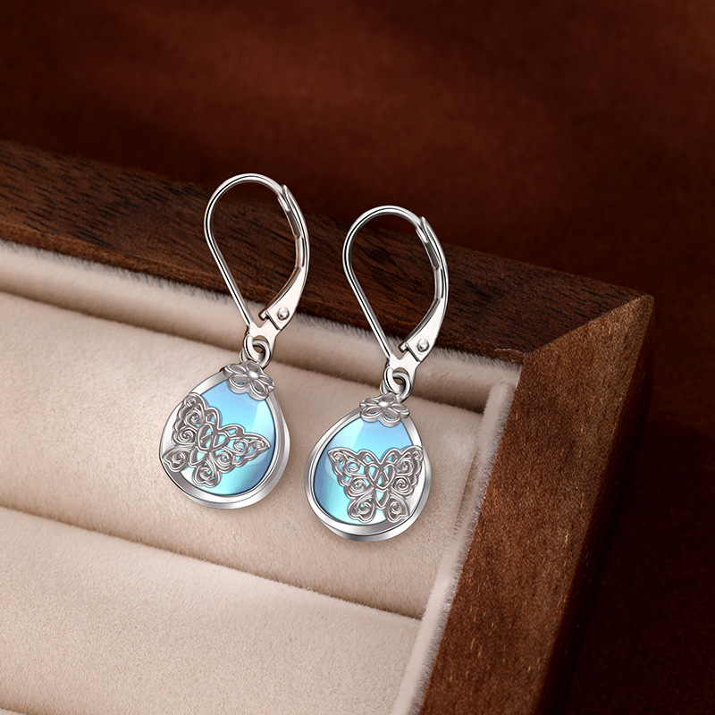925 aretes de mariposa de flores de plata esterlina para mujeres lujosas europeas y estadounidenses de alta sensación de auriculares de piedra de luz de la luna Amazon auriculares transfronterizos