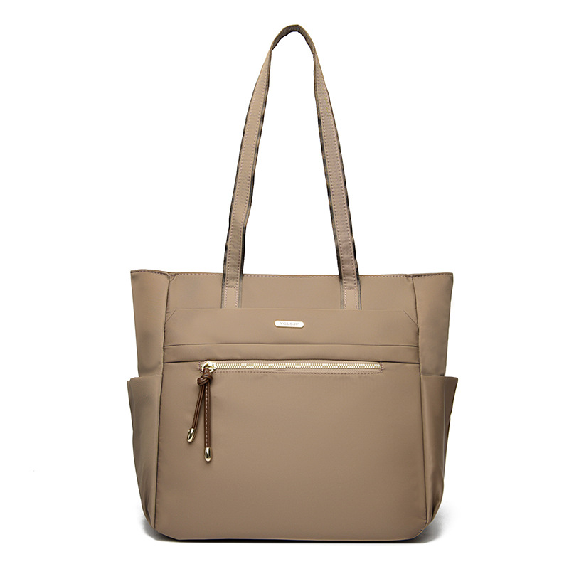 Bolso Tote casual coreano 2025 nueva moda textura de viaje salvaje bolso de mano de un solo hombro suministro directo de fábrica