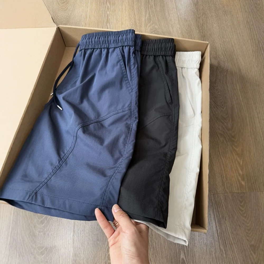 Navy blue diagonal cut quick-dry sports shorts for men, summer thin ice silk casual pants, American-style straight-leg knee-length shorts