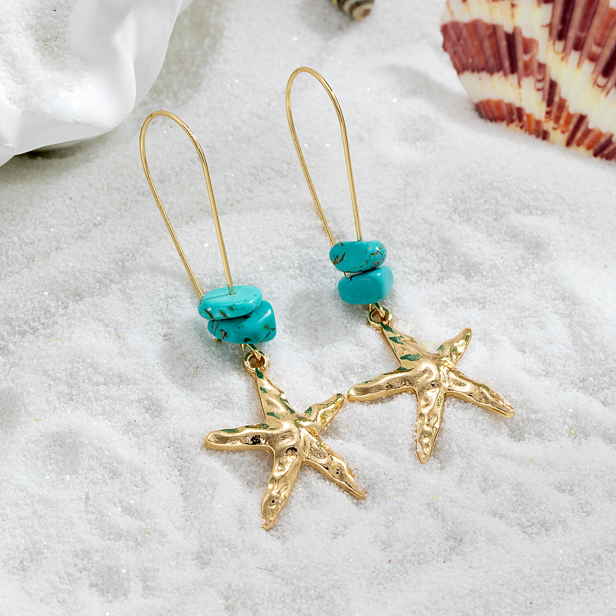 Orecchini pendenti a forma di stella marina con perline turchese_voghion.com