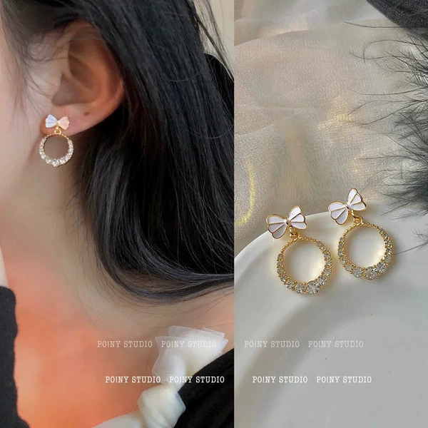 White earrings with bow