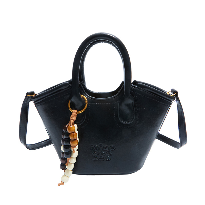 Bolsa de aire coreana para mujeres 2025, otoño y invierno, nuevo estilo de alta calidad, bolso de cubo portátil, bolso de hombro para viajar.