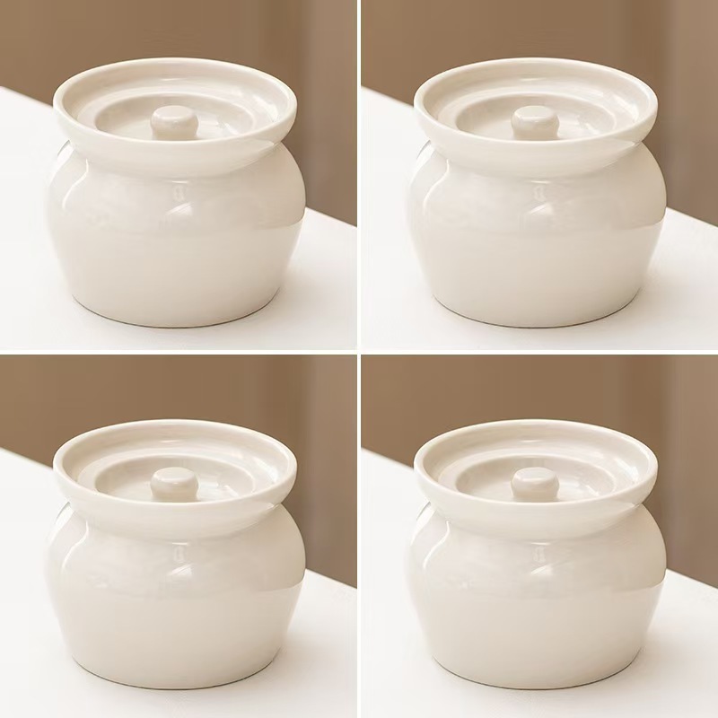 陶磁器のシチューは水をあけて家庭用のツバメの巣の専用の蒸し器を煮込んで蓋をします。|undefined