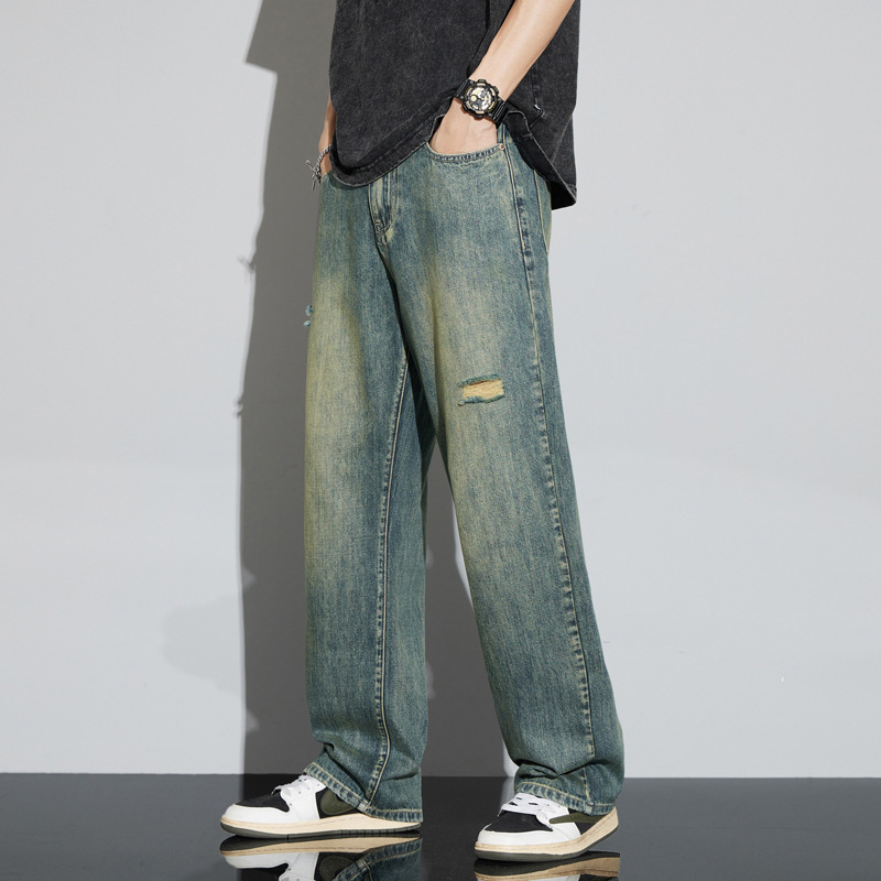メンズjeans春夏薄っぺらな感じのゆるいカジュアルなストレートレトロな破れたジーンズの男性の現物卸売り