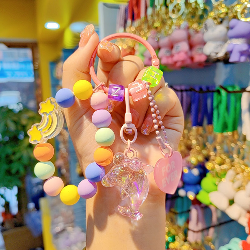Nuevo acrílico delfín cuentas llavero bolsos creativos colgantes pequeños regalos frescos de cuentas de color al por mayor