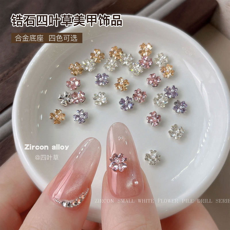 Sparkling zircon four-leaf flower nail art accessory with alloy base, light luxury three-dimensional small flower, wearable nail sticker with rhinestone decoration Sparkling zircon four-leaf flower nail art accessory with alloy base, light luxury three-dimensional small flower, wearable nail sticker with rhinestone decoration