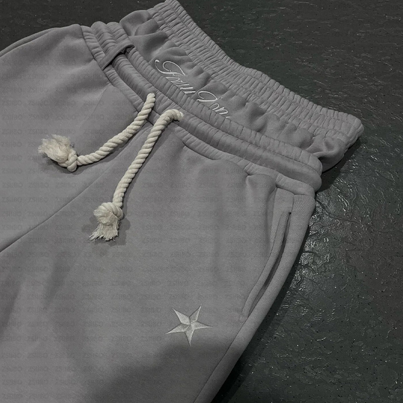 2025 nuevo otoño y invierno pesado estilo europeo y americano doble cintura cabeza de moda para hombres y mujeres pantalones de correa sueltos bordados pantalones al por mayor