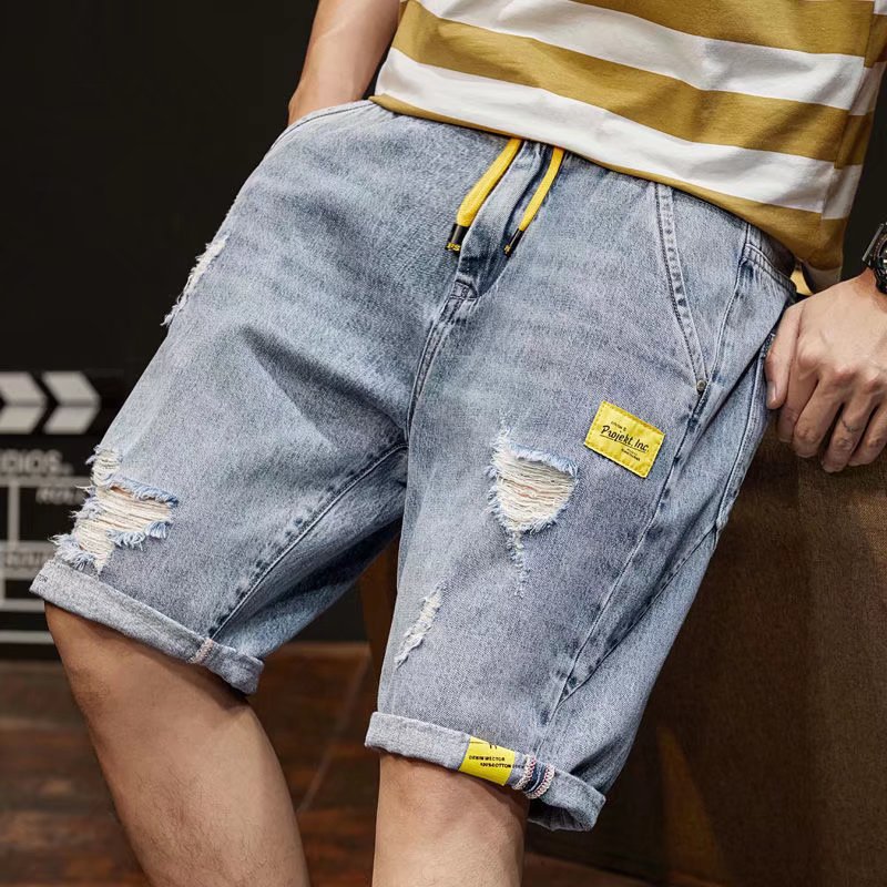 Pantalones cortos de mezclilla de los hombres pantalones cortos sueltos de moda casual Tallas grandes cintura elástica ripped estilo coreano desgaste exterior shorts flujo