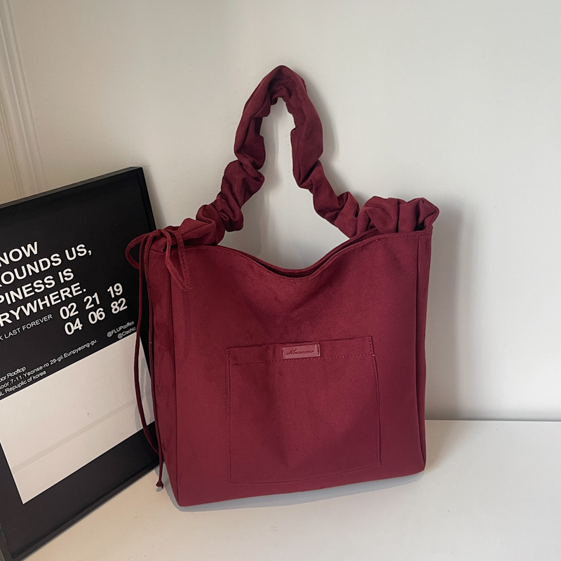 2025 otoño y invierno retro gaúster bolsas de balde de agua de mujer ocio versátil bolsas tote de gran capacidad plegadas mochila de hombro