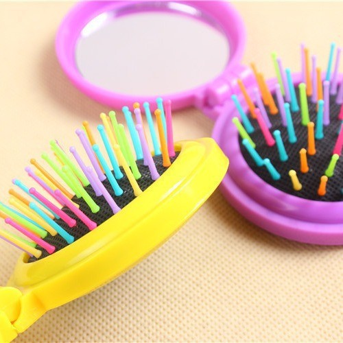 T nuevo redondo portátil con espejo peinado plegable para niños cabello suave arco iris peine al por mayor mini airbag