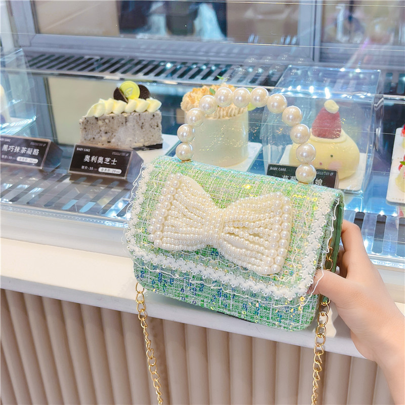 Nuevo bolso de los niños al por mayor Chunxi nuevo arco accesorios bolsa niña fuera monedero crossbody bolsa