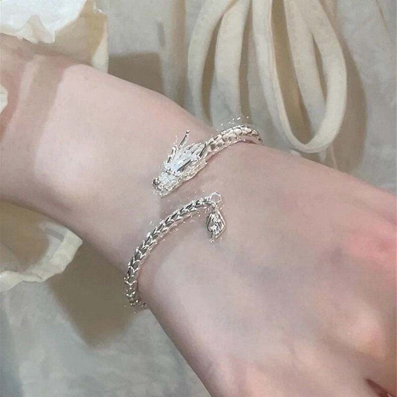 El temperamento elegante del dragón de la marea nacional pulsera de cola de oscilación femenina abertura en forma de dragón pulsera ajustable joyas del zodiaco